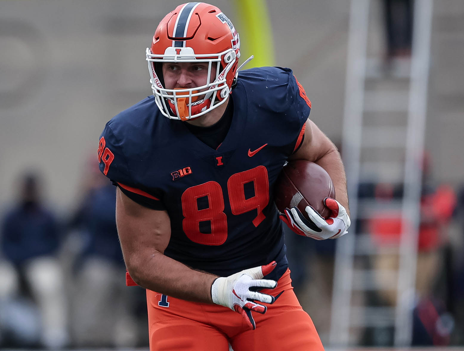 CHAMPAIGN, IL - NOVEMBER 12: Tip Reiman #89 of the Illinois Fighting Illini runs the ball during the first half against the Illinois Fighting Illini at Memorial Stadium on November 12, 2022 in Champaign, Illinois. (Photo by Michael Hickey/Getty Images)