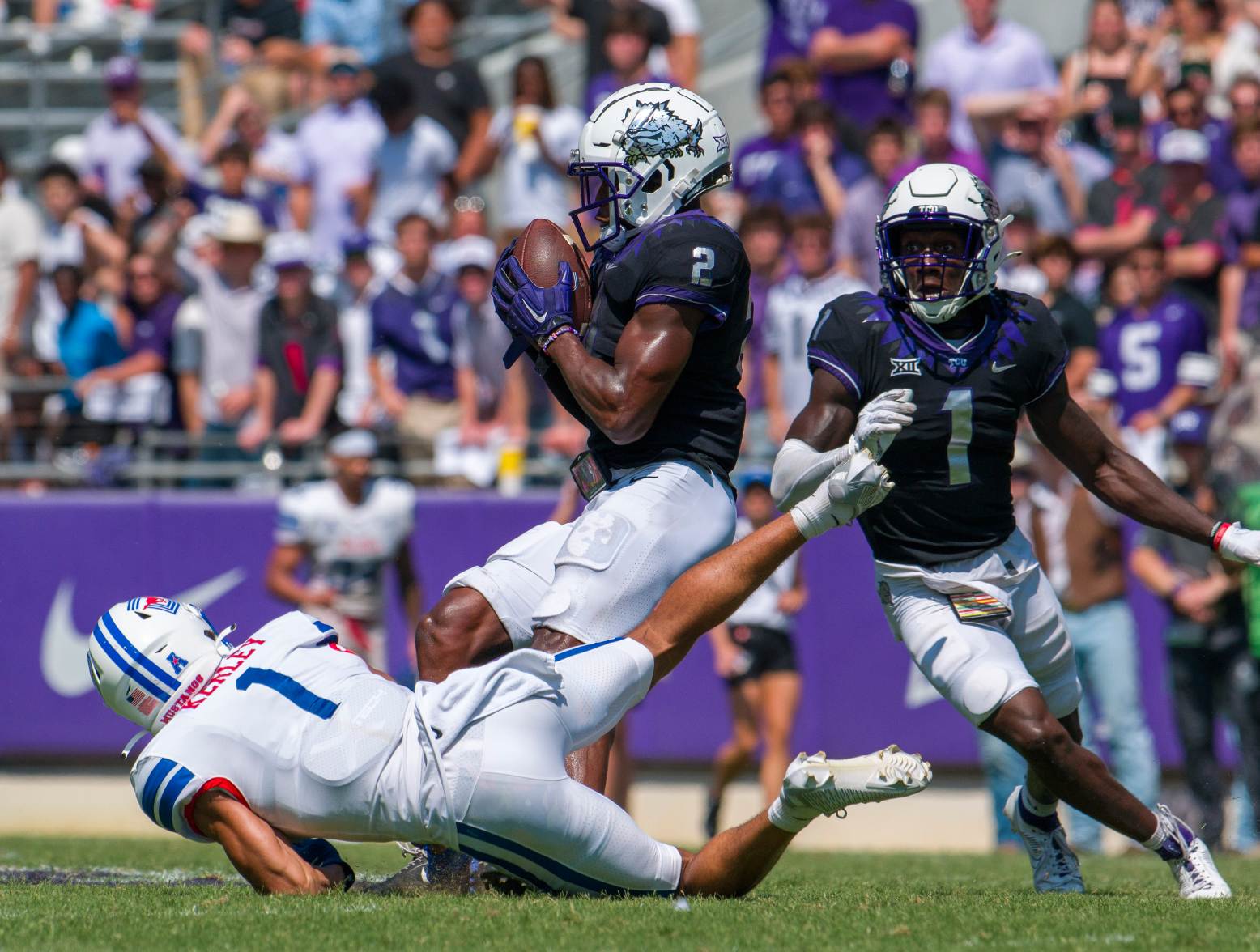 Sep 23, 2023; Fort Worth, Texas, USA; TCU Horned Frogs cornerback Josh Newton (2) intercepts a pass intended for SMU Mustangs wide receiver Jordan Kerley (1) during the second half at Amon G. Carter Stadium. Credit: Jerome Miron-USA TODAY Sports