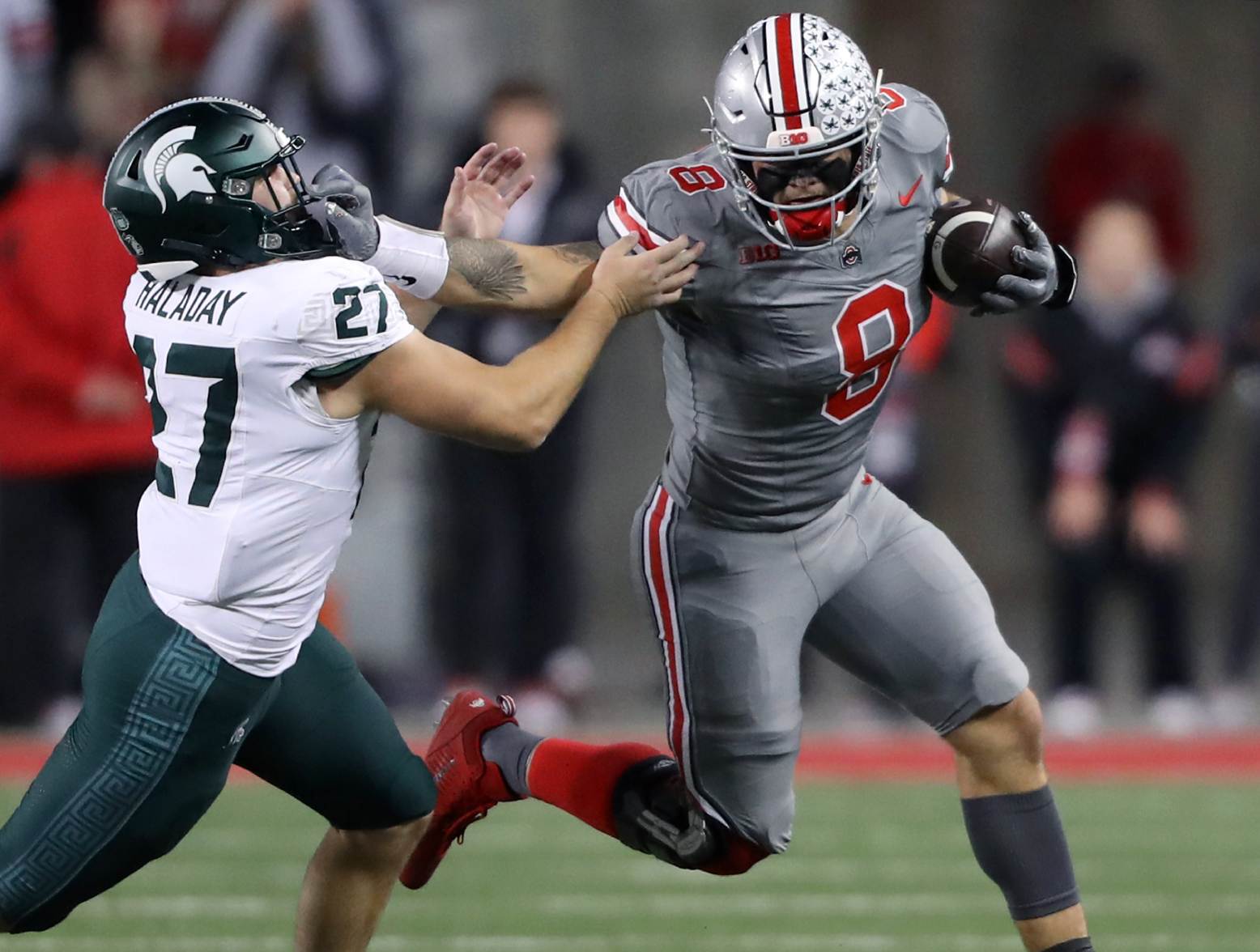 Nov 11, 2023; Columbus, Ohio, USA; Ohio State Buckeyes tight end Cade Stover (8) catches the football as Michigan State Spartans linebacker Cal Haladay (27) makes the tackle during the first quarter at Ohio Stadium. Credit: Joseph Maiorana-USA TODAY Sports