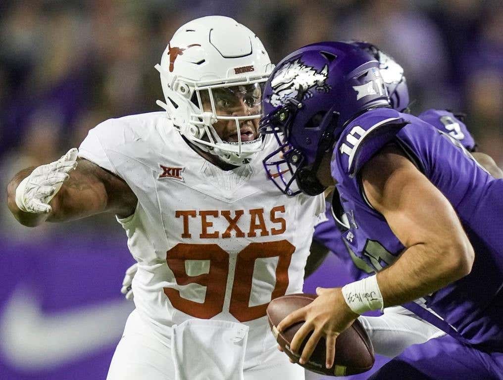 Texas Longhorns defensive lineman Byron Murphy II (90) sacks TCU Horned Frogs quarterback Josh Hoover (10) in the second quarter of an NCAA college football game, Saturday, November. 11, 2023, at Amon G. Carter Stadium in Fort Worth, Texas. (Ricardo B. Brazziell/American-Statesman/USA TODAY Network)