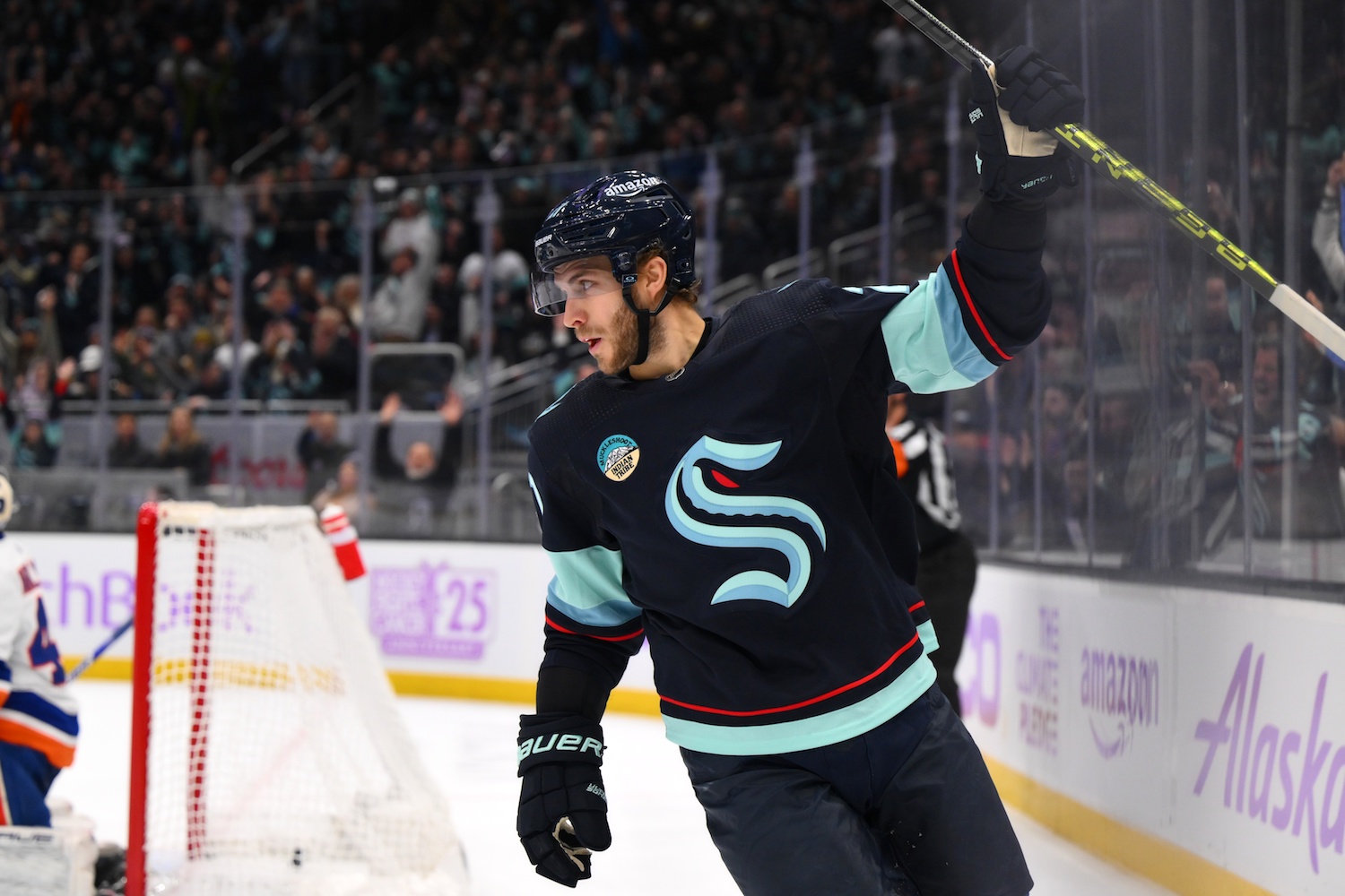 Nov 16, 2023; Seattle, Washington, USA; Seattle Kraken center Alex Wennberg (21) celebrates scoring a goal against the New York Islanders during the first period at Climate Pledge Arena. Mandatory Credit: Steven Bisig-USA TODAY Sports