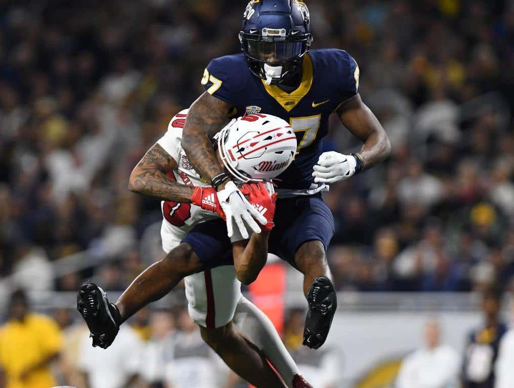 Dec 2, 2023; Detroit, MI, USA; Toledo Rockets cornerback Quinyon Mitchell (27) breaks up a pass intended for Miami (OH) Redhawks wide receiver Gage Larvadain (10) in the third quarter at Ford Field. Credit: Lon Horwedel-USA TODAY Sports