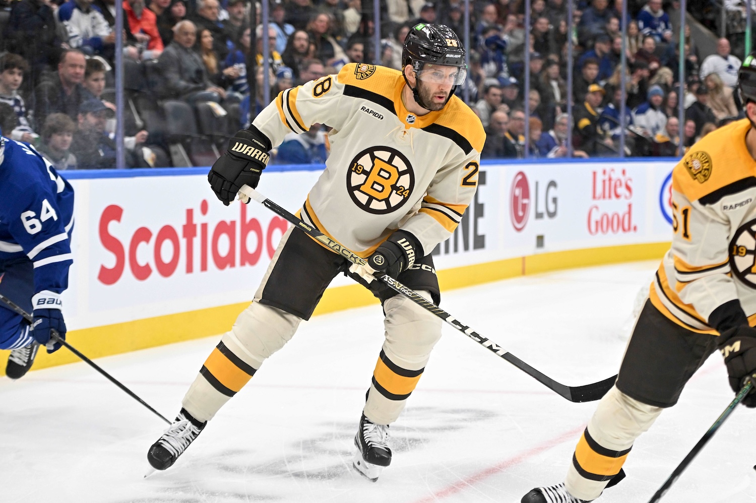 Dec 2, 2023; Toronto, Ontario, CAN; Boston Bruins defenseman Derek Forbort (28) pursues the play against the Toronto Maple Leaf in the first period at Scotiabank Arena. Mandatory Credit: Dan Hamilton-USA TODAY Sports