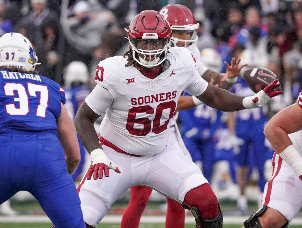 Oct 28, 2023; Lawrence, Kansas, USA; Oklahoma Sooners offensive lineman Tyler Guyton (60) at the line of scrimmage against the Kansas Jayhawks during the game at David Booth Kansas Memorial Stadium. Credit: Denny Medley-USA TODAY Sports