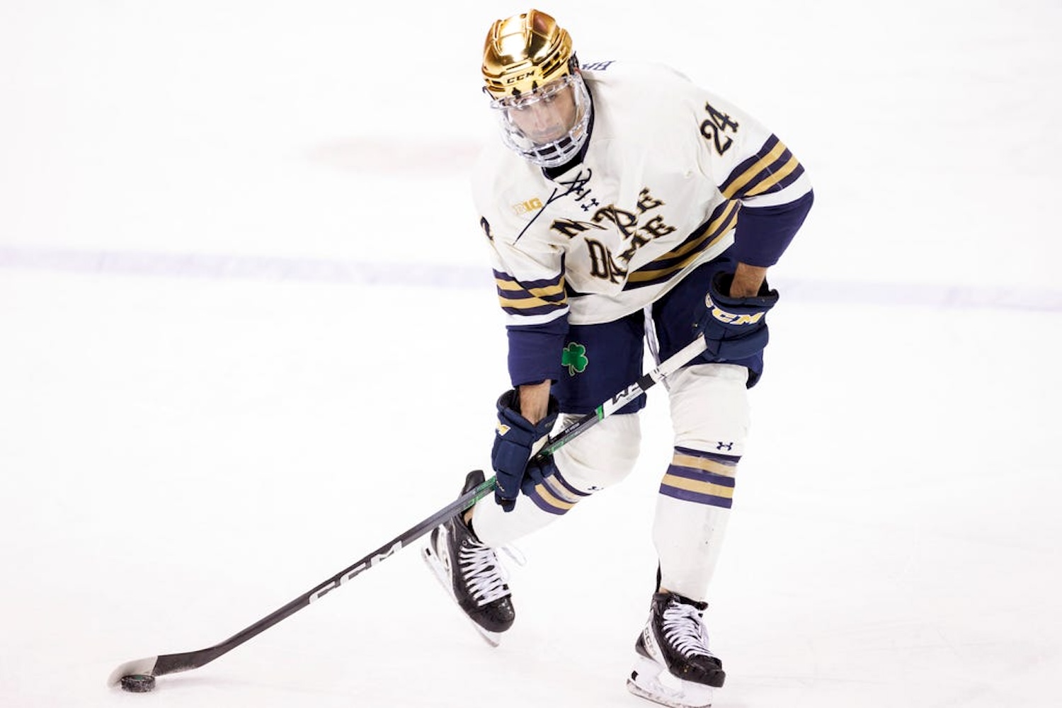 Notre Dame defenseman Drew Bavaro (24) shoots the puck during the Penn State-Notre Dame NCAA hockey game on Saturday, January 20, 2024, at Compton Family Ice Arena in South Bend, Indiana.