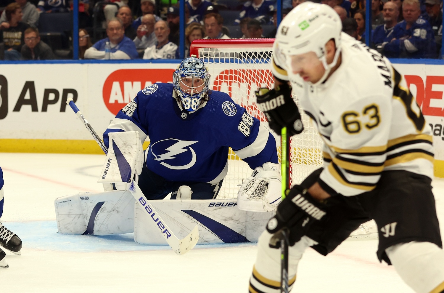 Mar 27, 2024; Tampa, Florida, USA; Tampa Bay Lightning goaltender Andrei Vasilevskiy (88) watches Boston Bruins left wing Brad Marchand (63) during the second period at Amalie Arena. Mandatory Credit: Kim Klement Neitzel-USA TODAY Sports