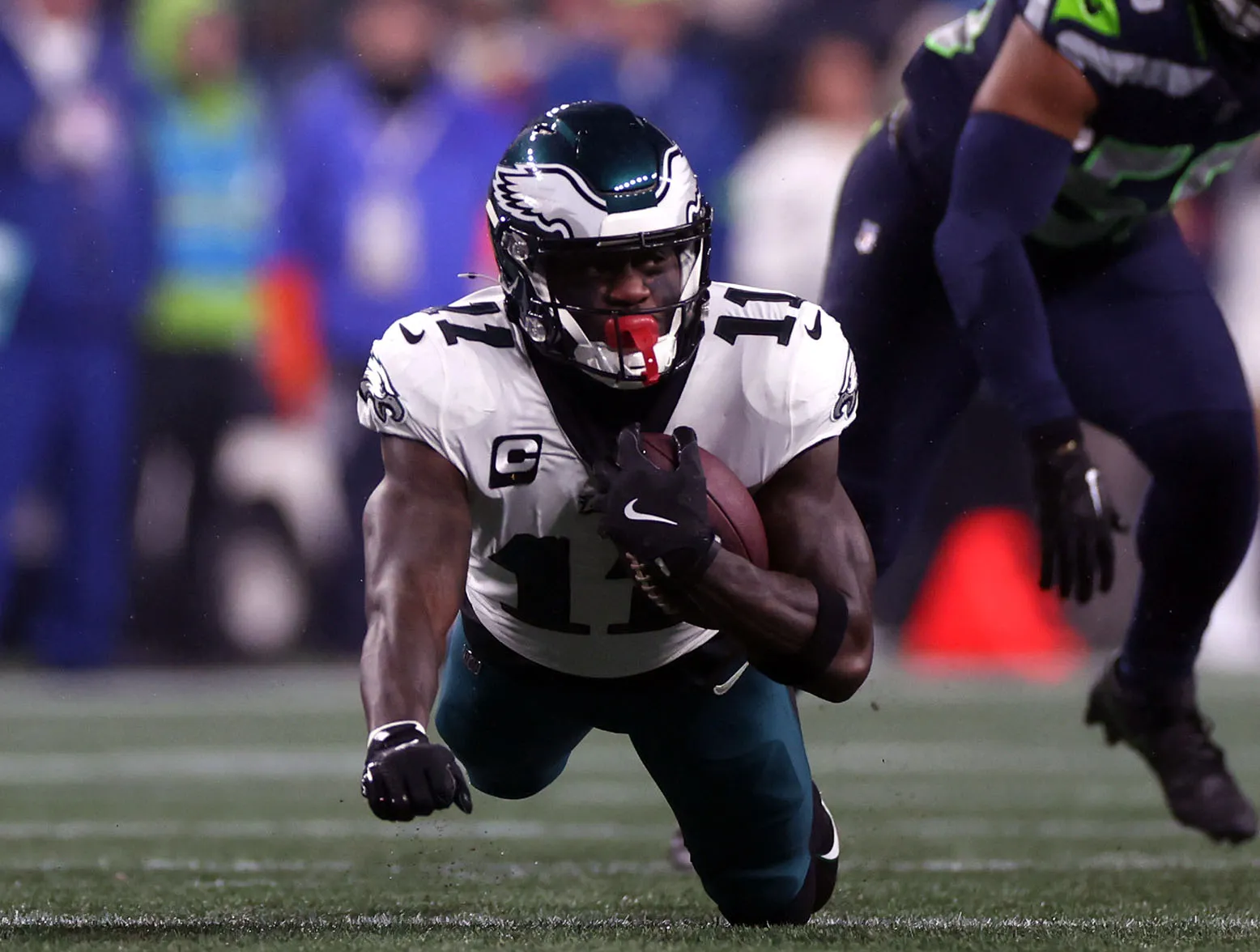 SEATTLE, WASHINGTON - DECEMBER 18: A.J. Brown #11 of the Philadelphia Eagles catches a pass in the first quarter against the Seattle Seahawks at Lumen Field on December 18, 2023 in Seattle, Washington. (Photo by Steph Chambers/Getty Images)