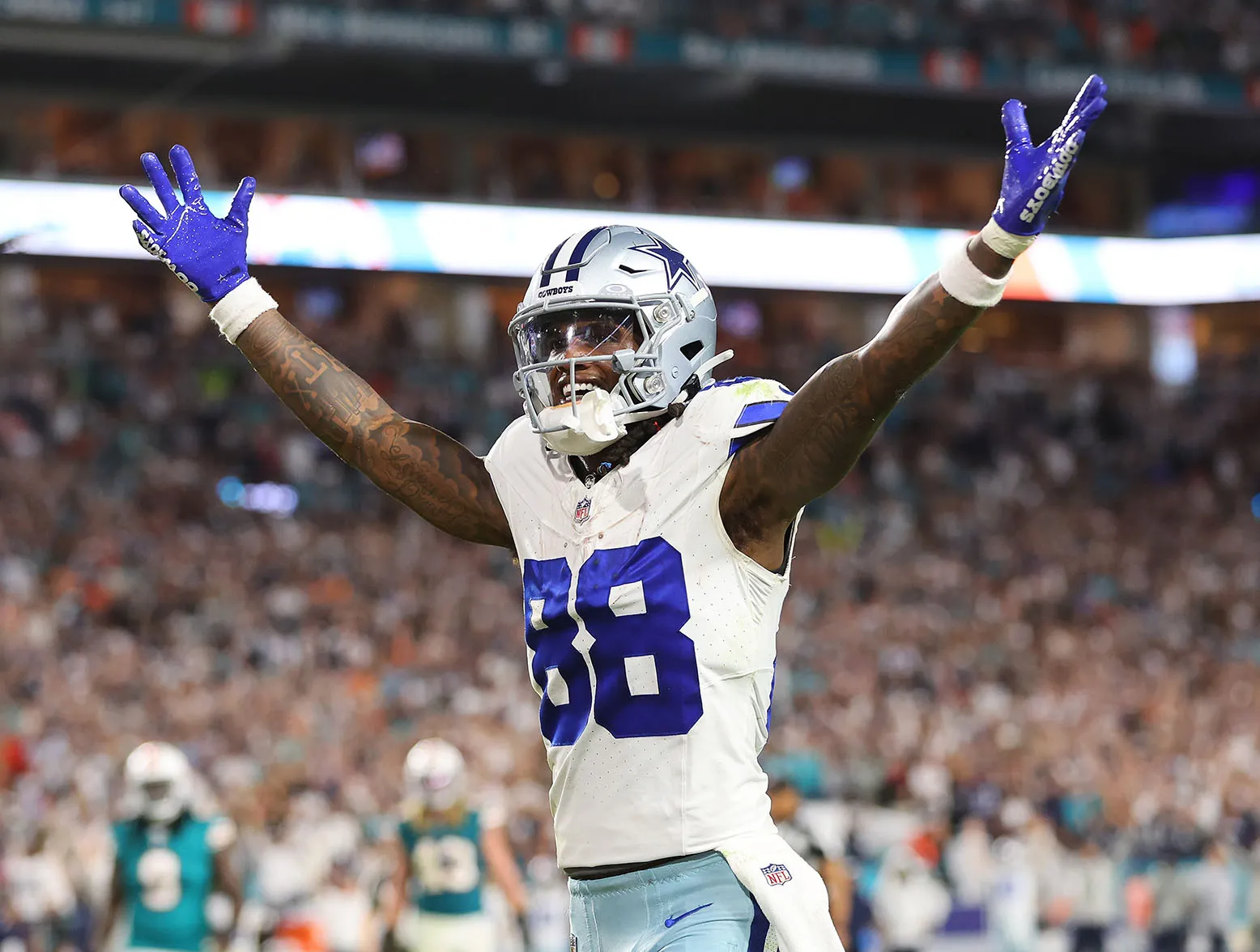 MIAMI GARDENS, FLORIDA - DECEMBER 24: CeeDee Lamb #88 of the Dallas Cowboys celebrates a touchdown during a game against the Miami Dolphins at Hard Rock Stadium on December 24, 2023 in Miami Gardens, Florida. (Photo by Stacy Revere/Getty Images)