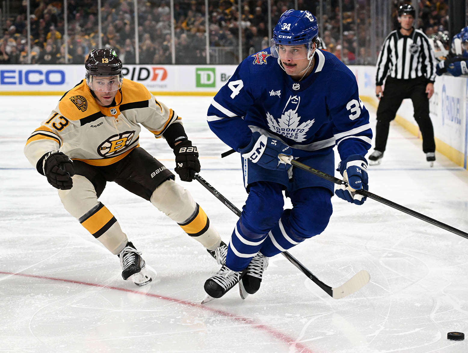 Nov 2, 2023; Boston, Massachusetts, USA; Toronto Maple Leafs center Auston Matthews (34) skates against Boston Bruins center Charlie Coyle (13) during the second period at the TD Garden. Mandatory Credit: Brian Fluharty-USA TODAY Sports