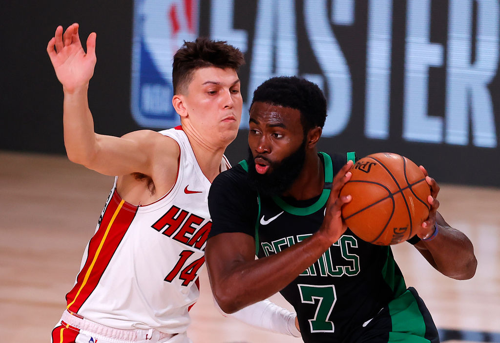 LAKE BUENA VISTA, FLORIDA - SEPTEMBER 25: Tyler Herro #14 of the Miami Heat defends Jaylen Brown #7 of the Boston Celtics during the first quarter against the Boston Celtics in Game Five of the Eastern Conference Finals during the 2020 NBA Playoffs at AdventHealth Arena at the ESPN Wide World Of Sports Complex on September 25, 2020 in Lake Buena Vista, Florida. (Photo by Mike Ehrmann/Getty Images)