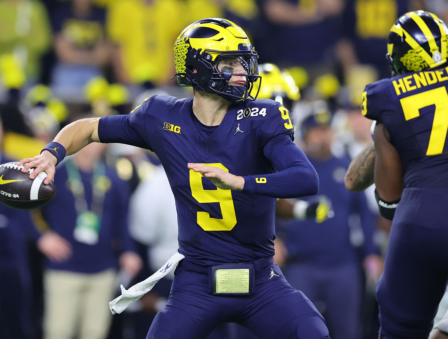 HOUSTON, TEXAS - JANUARY 08: J.J. McCarthy #9 of the Michigan Wolverines throws the ball in the second quarter against the Washington Huskies during the 2024 CFP National Championship game at NRG Stadium on January 08, 2024 in Houston, Texas. (Photo by Stacy Revere/Getty Images)