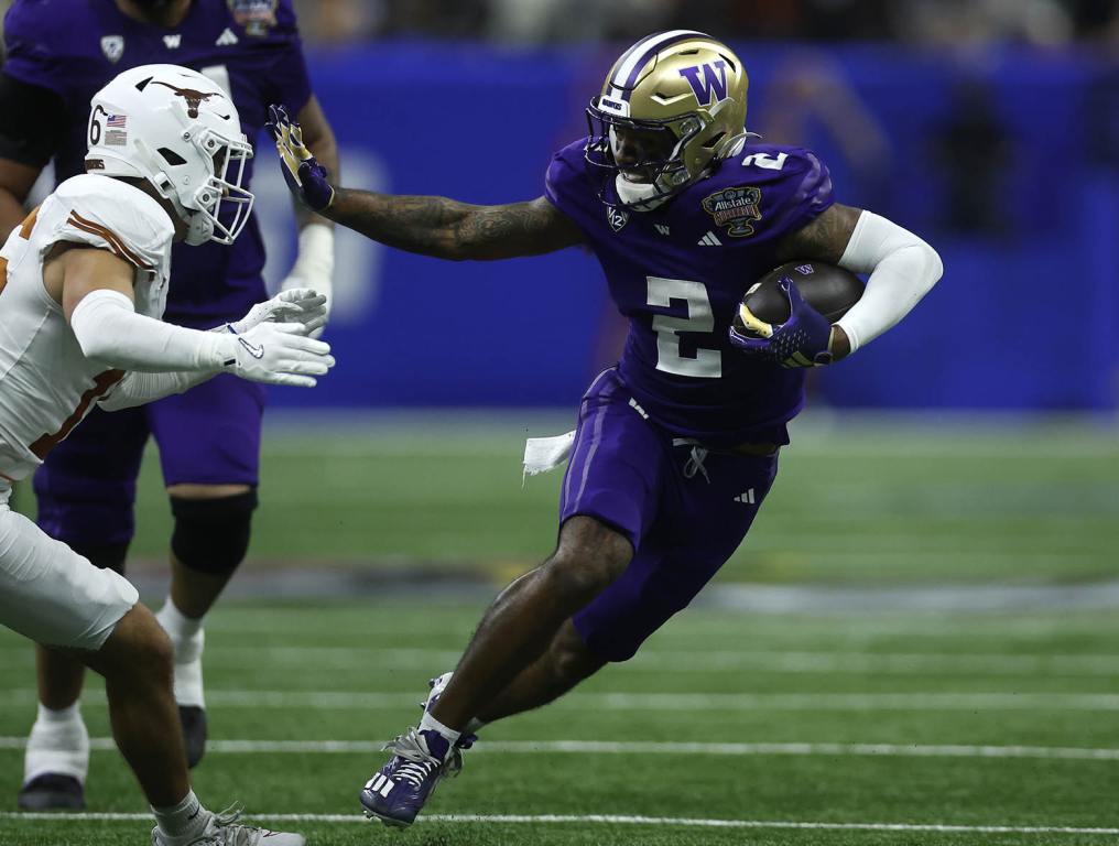 NEW ORLEANS, LOUISIANA - JANUARY 01: Ja'Lynn Polk #2 of the Washington Huskies runs with the ball during the third quarter against the Texas Longhorns during the CFP Semifinal Allstate Sugar Bowl at Caesars Superdome on January 01, 2024 in New Orleans, Louisiana. (Photo by Chris Graythen/Getty Images)