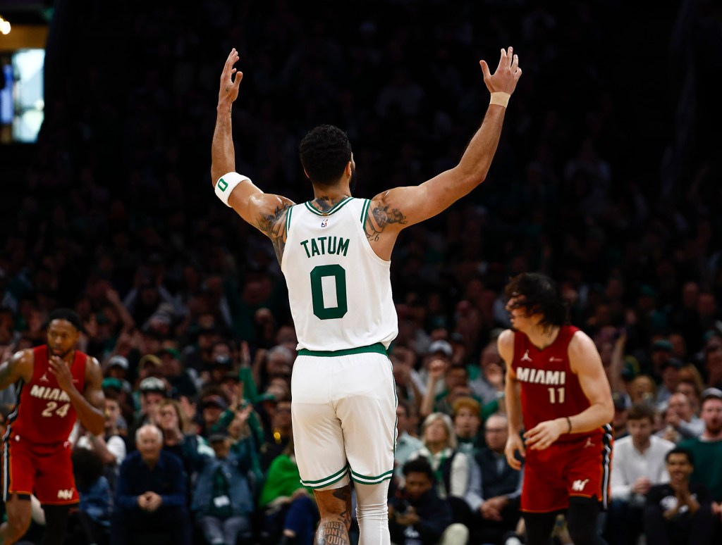 BOSTON, MA - APRIL 21: Jayson Tatum #0 of the Boston Celtics raises his hands after making a three point basket against the Miami Heat during the first quarter of game one of the Eastern Conference First Round Playoffs at TD Garden on April 21, 2024 in Boston, Massachusetts. (Photo By Winslow Townson/Getty Images)