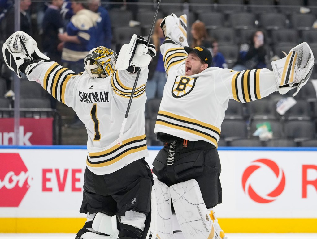 Apr 24, 2024; Toronto, Ontario, CAN; Boston Bruins goaltender Linus Ullmark (right) congratulates goaltender Jeremy Swayman (1) on a win over the Toronto Maple Leafs in game three of the first round of the 2024 Stanley Cup Playoffs at Scotiabank Arena. Mandatory Credit: John E. Sokolowski-USA TODAY Sports