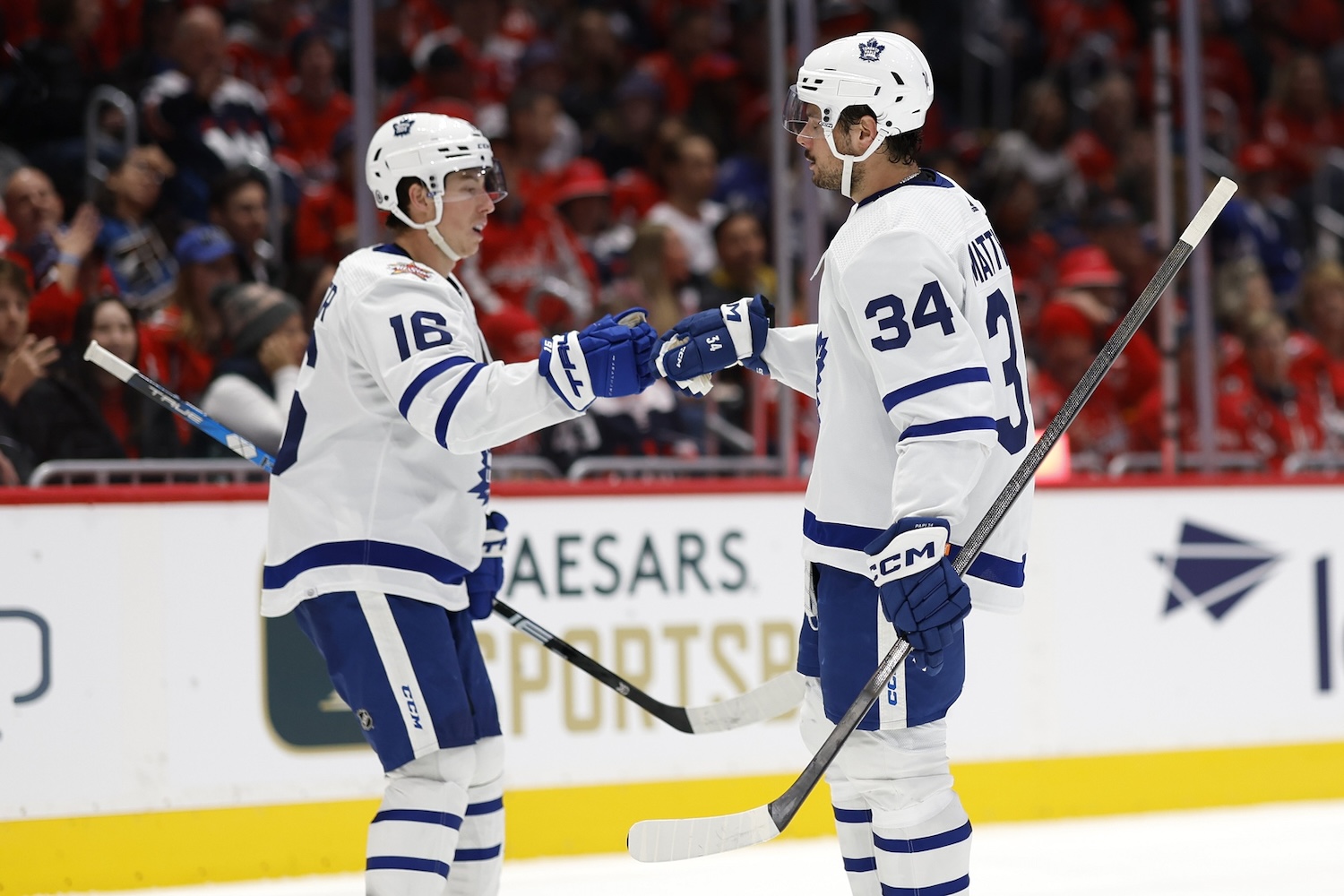 Oct 24, 2023; Washington, District of Columbia, USA; Toronto Maple Leafs center Auston Matthews (34) celebrates with Maple Leafs right wing Mitchell Marner (16) after scoring a goal against the Washington Capitals in the second period at Capital One Arena. Mandatory Credit: Geoff Burke-USA TODAY Sports