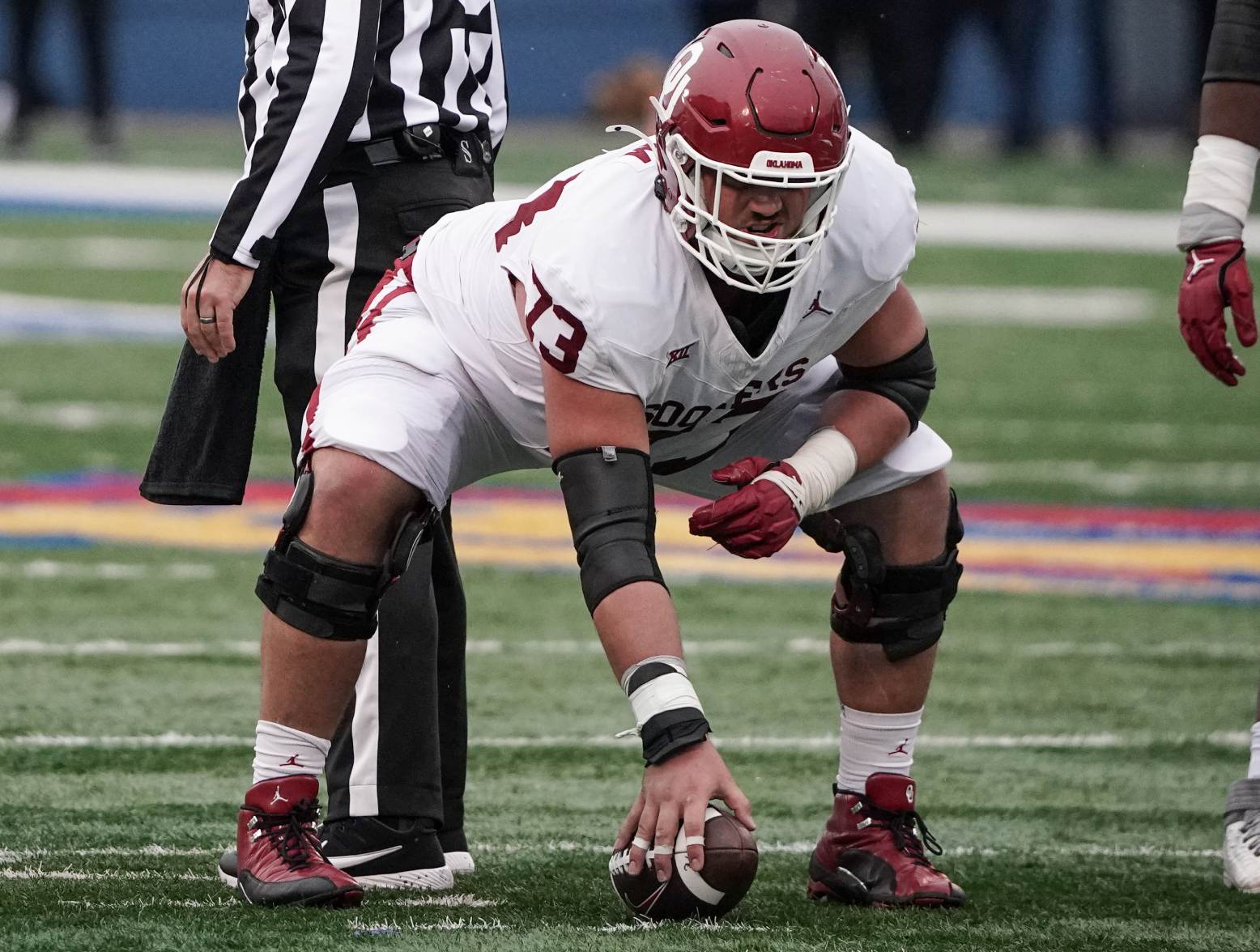 Oct 28, 2023; Lawrence, Kansas, USA; Oklahoma Sooners offensive lineman Andrew Raym (73) at the line of scrimmage against the Kansas Jayhawks during the game at David Booth Kansas Memorial Stadium. Credit: Denny Medley-USA TODAY Sports