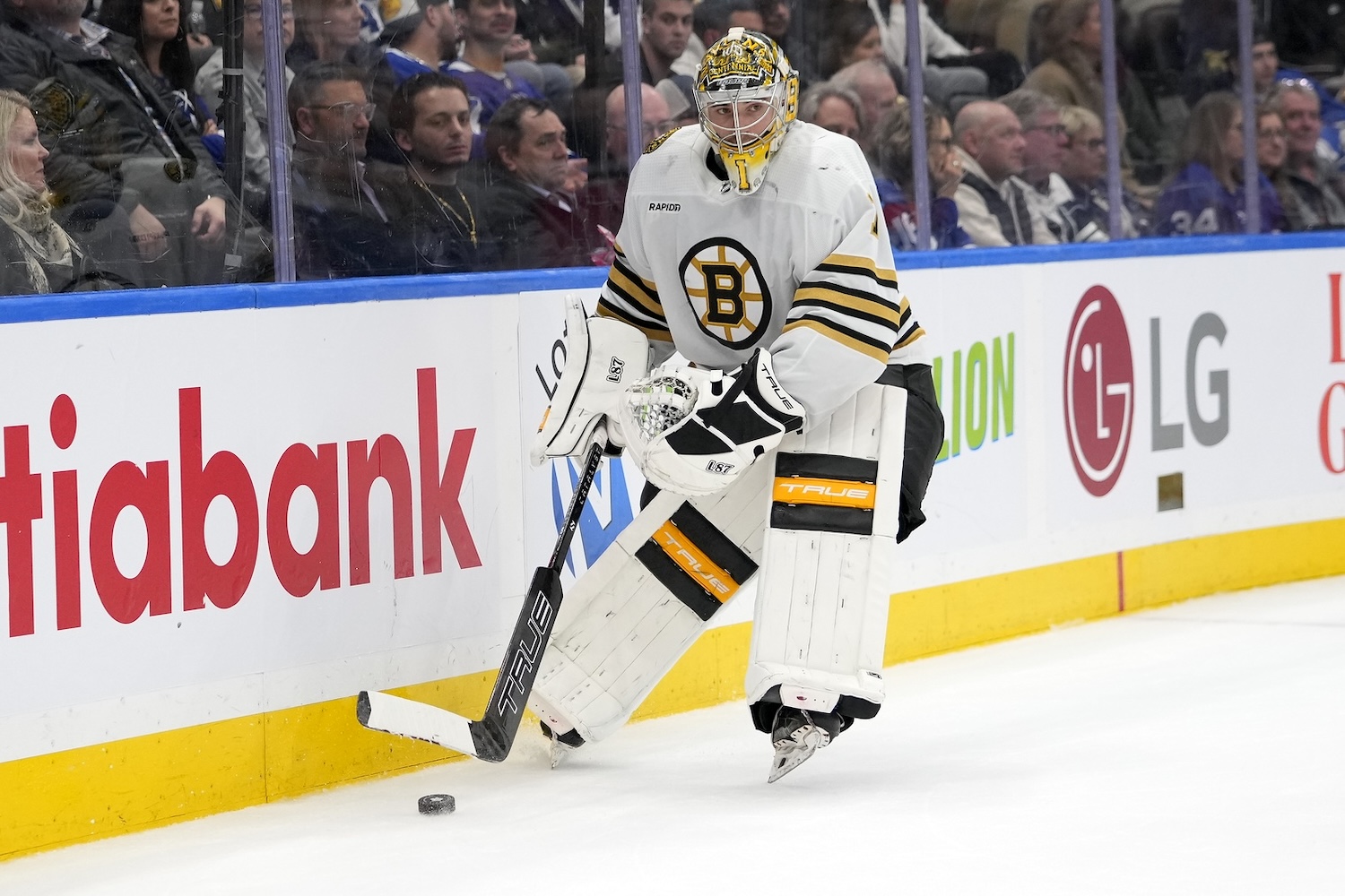 Mar 4, 2024; Toronto, Ontario, CAN; Boston Bruins goaltender Jeremy Swayman (1) goes to pass the puck against the Toronto Maple Leafs during the third period at Scotiabank Arena. Mandatory Credit: John E. Sokolowski-USA TODAY Sports