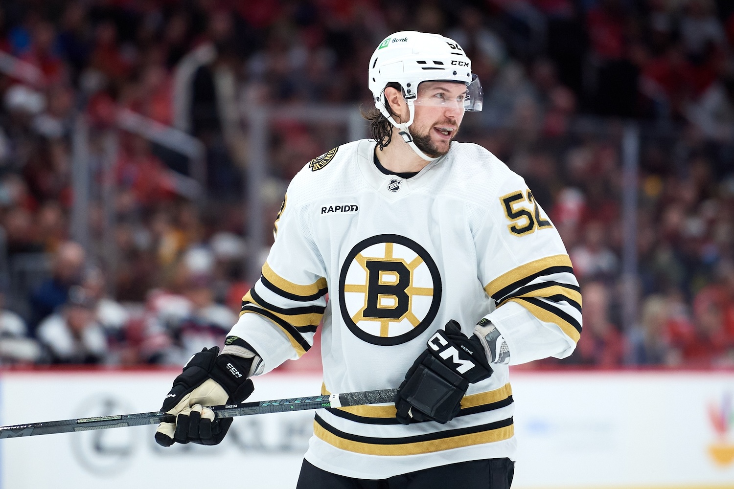 Mar 30, 2024; Washington, District of Columbia, USA; Boston Bruins defenseman Andrew Peeke (52) prepares for a face-off against the Washington Capitals during the second period at Capital One Arena. Mandatory Credit: Hannah Foslien-USA TODAY Sports