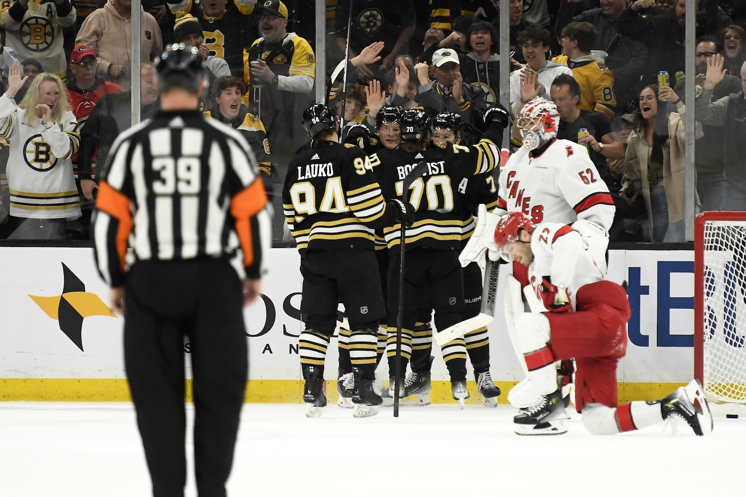 Apr 9, 2024; Boston, Massachusetts, USA; Boston Bruins defenseman Charlie McAvoy (73) is congratulated by his teammates after scoring a goal during the second period against the Carolina Hurricanes at TD Garden. Mandatory Credit: Bob DeChiara-USA TODAY Sports