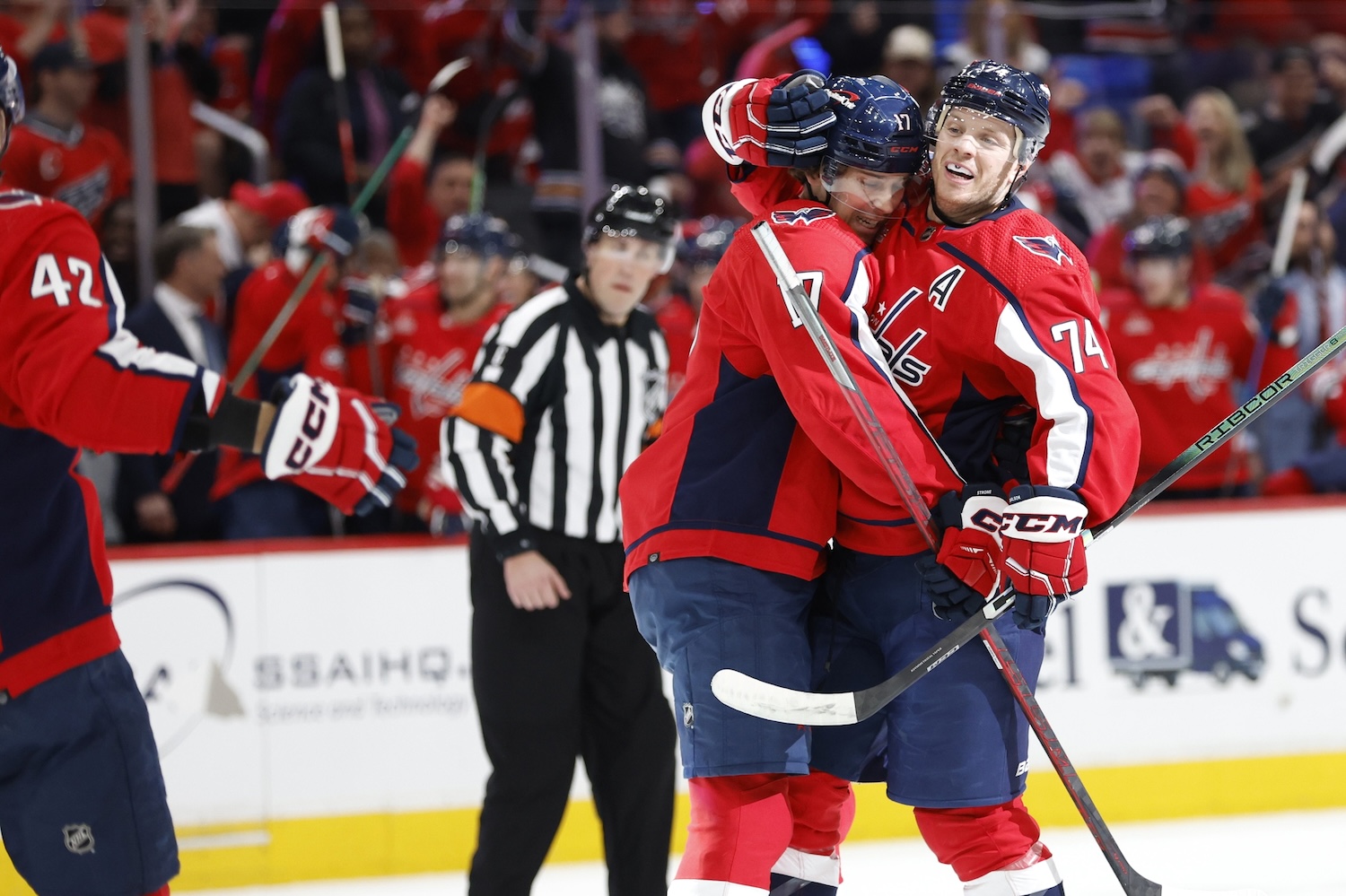 Apr 15, 2024; Washington, District of Columbia, USA; Washington Capitals defenseman John Carlson (74) celebrates with Capitals center Dylan Strome (17) after scoring a goal against the Boston Bruins in the first period at Capital One Arena. Mandatory Credit: Geoff Burke-USA TODAY Sports