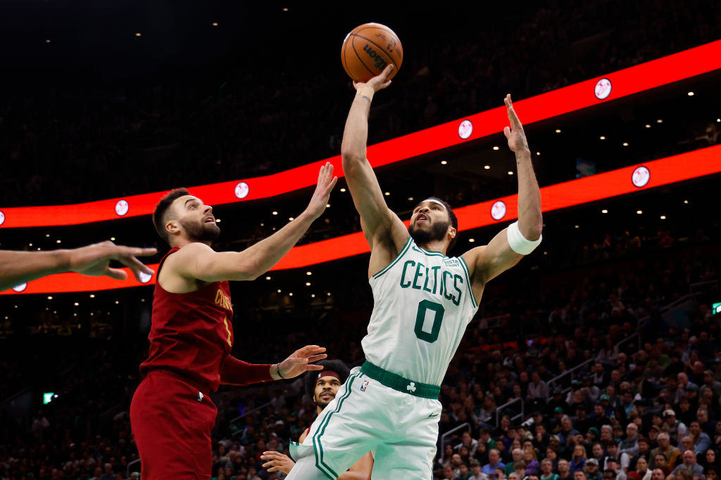 BOSTON, MA - DECEMBER 14: Jayson Tatum #0 of the Boston Celtics goes for a shot against Max Strus #1 of the Cleveland Cavaliers during the second half at TD Garden on December 14, 2023 in Boston, Massachusetts. (Photo By Winslow Townson/Getty Images)