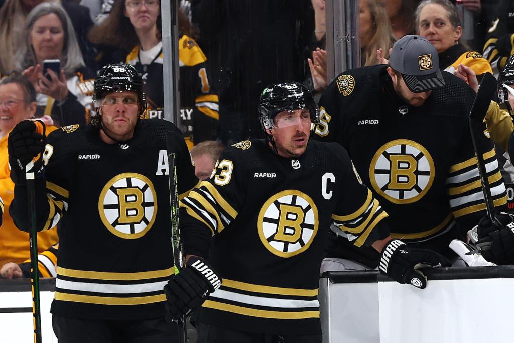 BOSTON, MASSACHUSETTS - APRIL 30: Brad Marchand #63 of the Boston Bruins and David Pastrnak #88 look on from the bench during the second period of Game Five of the First Round of the 2024 Stanley Cup Playoffs against the Toronto Maple Leafs at TD Garden on April 30, 2024 in Boston, Massachusetts. (Photo by Maddie Meyer/Getty Images)