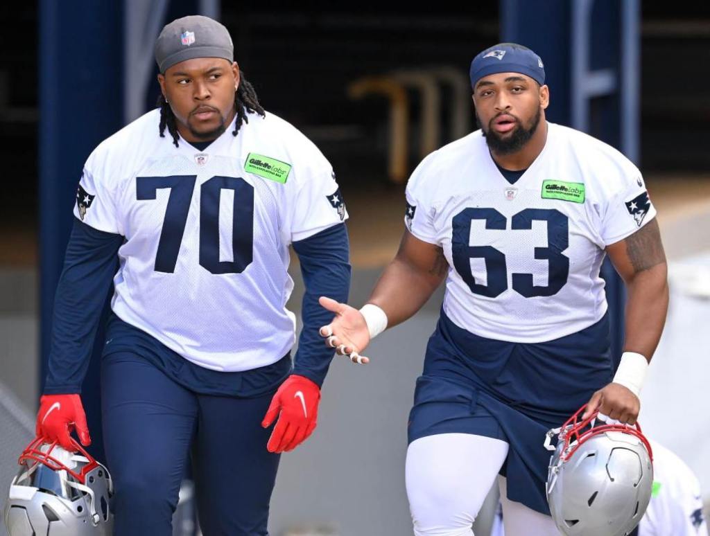 May 11, 2024; Foxborough, MA, USA; New England Patriots offensive tackle Caedan Wallace (70) and guard Layden Robinson (63) arrive at practice at the New England Patriots rookie camp at Gillette Stadium. Credit: Eric Canha-USA TODAY Sports