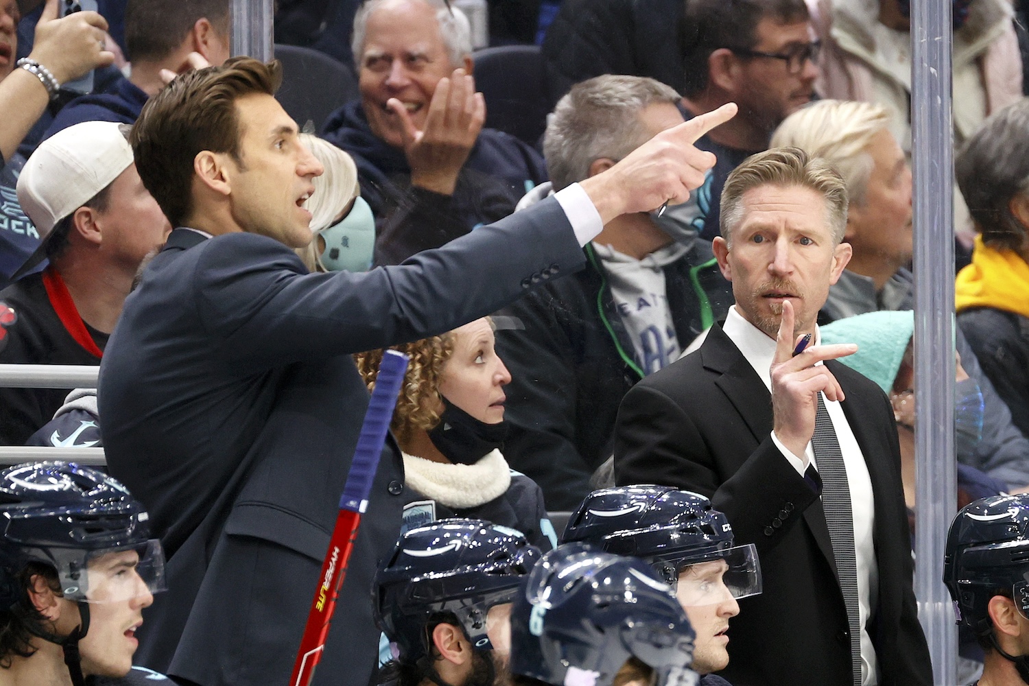 SEATTLE, WASHINGTON - NOVEMBER 17: Assistant coach Jay Leach and head coach Dave Hakstol of the Seattle Kraken look on against the Chicago Blackhawks during the third period at Climate Pledge Arena on November 17, 2021 in Seattle, Washington. (Photo by Steph Chambers/Getty Images)