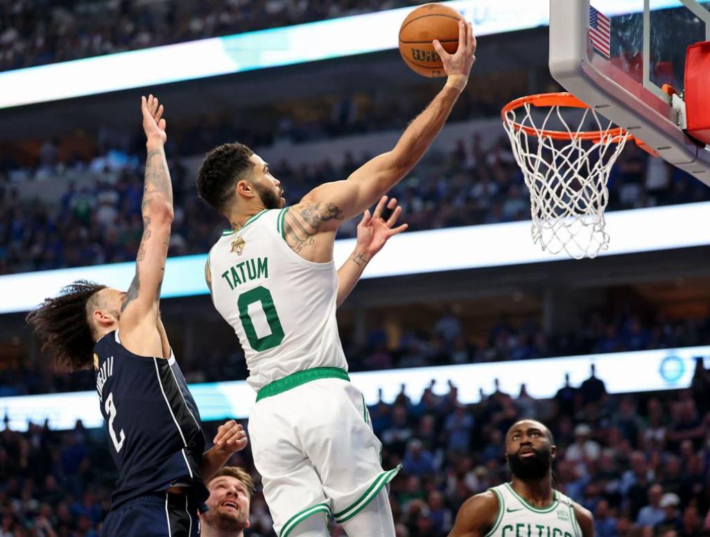 Jun 12, 2024; Dallas, Texas, USA; Boston Celtics forward Jayson Tatum (0) shoots the ball against Dallas Mavericks center Dereck Lively II (2) during the second quarter during game three of the 2024 NBA Finals at American Airlines Center. Mandatory Credit: Kevin Jairaj-USA TODAY Sports