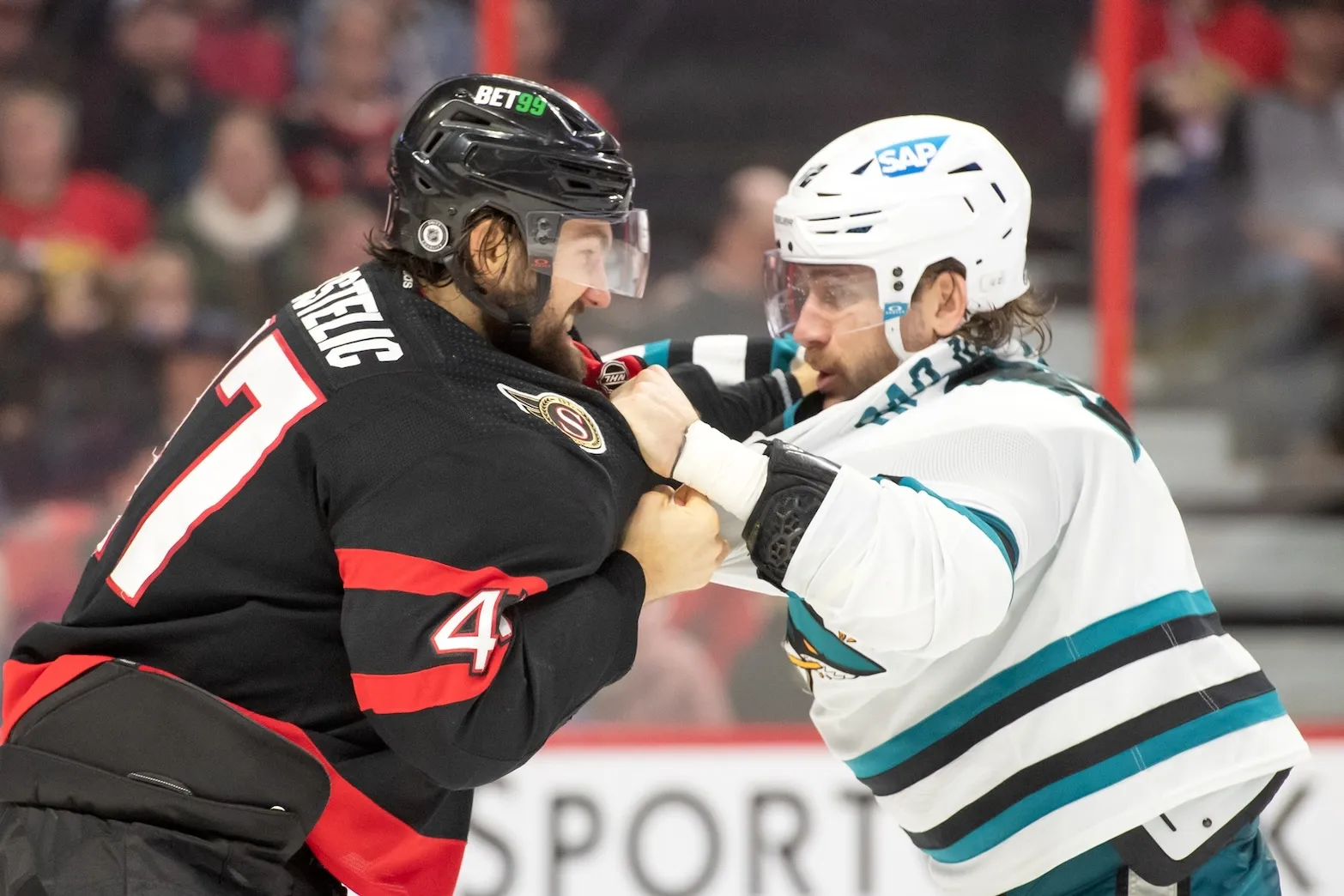 Dec 3, 2022; Ottawa, Ontario, CAN; Ottawa Senators center Mark Kastelic (47) fights with San Jose Sharks left wiing Jonah Gadjovich (42) in the second period at the Canadian Tire Centre. Mandatory Credit: Marc DesRosiers-USA TODAY Sports