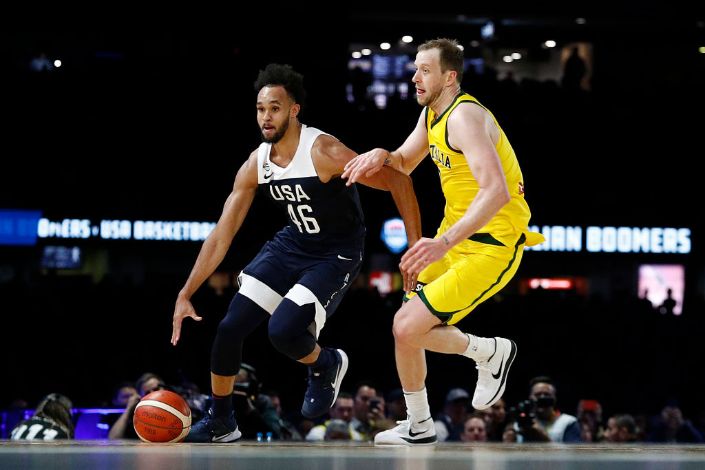 MELBOURNE, AUSTRALIA - AUGUST 24: Derrick White of the USA takes the ball up court defended by Nathan Sobey of Australia during game two of the International Basketball series between the Australian Boomers and United States of America at Marvel Stadium on August 24, 2019 in Melbourne, Australia. (Photo by Daniel Pockett/Getty Images)