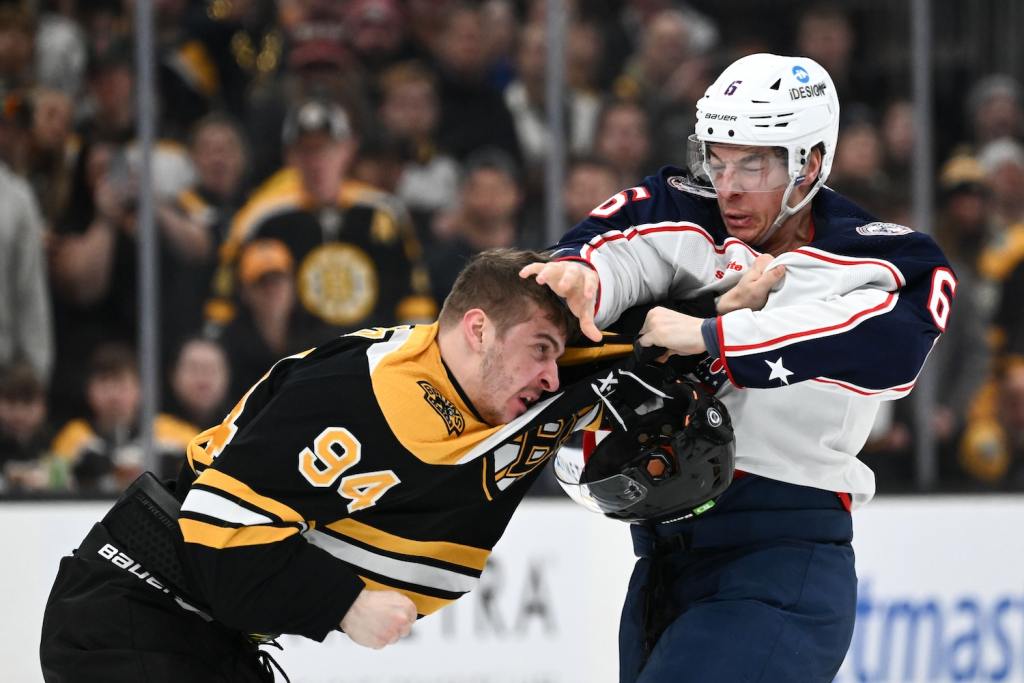 Mar 30, 2023; Boston, Massachusetts, USA; Boston Bruins center Jakub Lauko (94) fights Columbus Blue Jackets defenseman Billy Sweezey (6) during the second period at the TD Garden. Mandatory Credit: Brian Fluharty-USA TODAY Sports