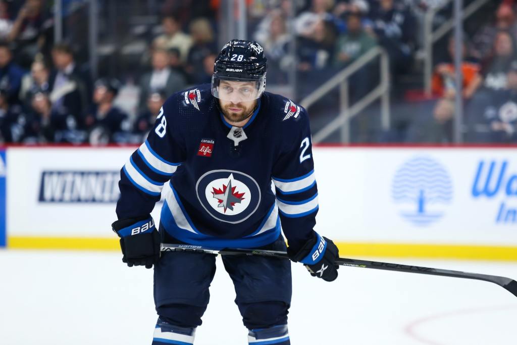 Sep 25, 2023; Winnipeg, Manitoba, CAN; Winnipeg Jets forward Jeffrey Viel (28) waits for the face-off against the Edmonton Oilers during the second period at Canada Life Centre. Mandatory Credit: Terrence Lee-USA TODAY Sports