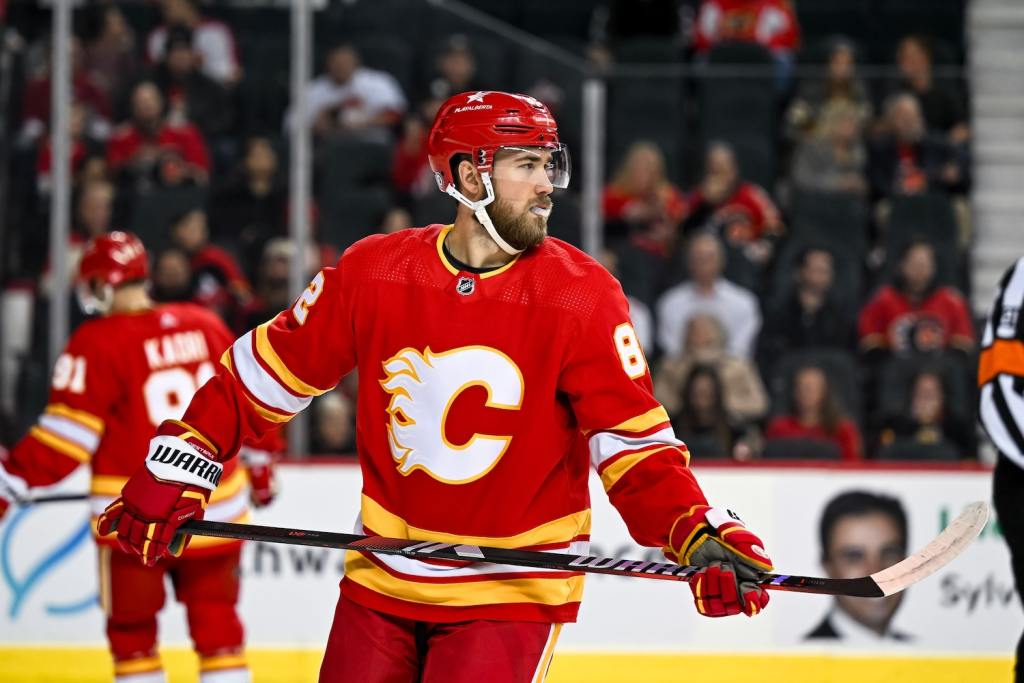 Jan 16, 2024; Calgary, Alberta, CAN; Calgary Flames defenseman Jordan Oesterle (82) looks on during the first period in a game against the Arizona Coyotes at Scotiabank Saddledome. Mandatory Credit: Brett Holmes-USA TODAY Sports