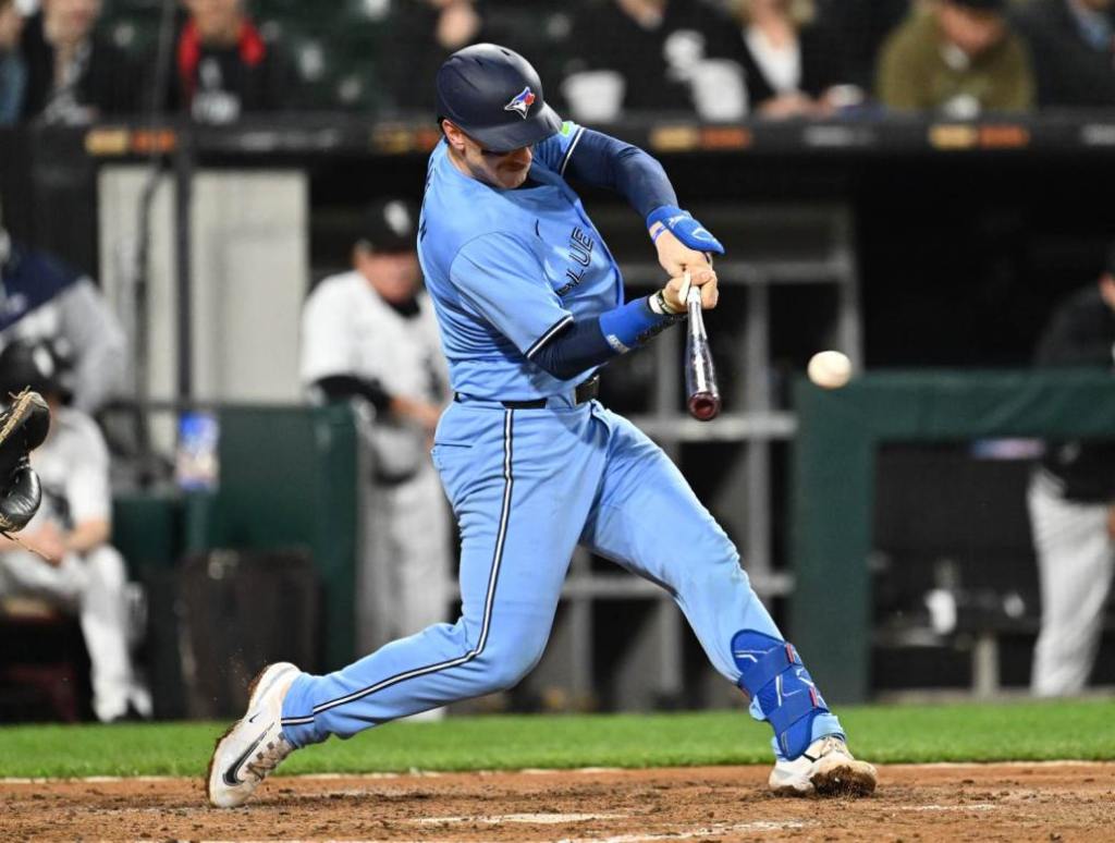 May 28, 2024; Chicago, Illinois, USA;  Toronto Blue Jays catcher Danny Jansen (9) hits a single in the fifth inning against the Chicago White Sox at Guaranteed Rate Field. Credit: Jamie Sabau-USA TODAY Sports