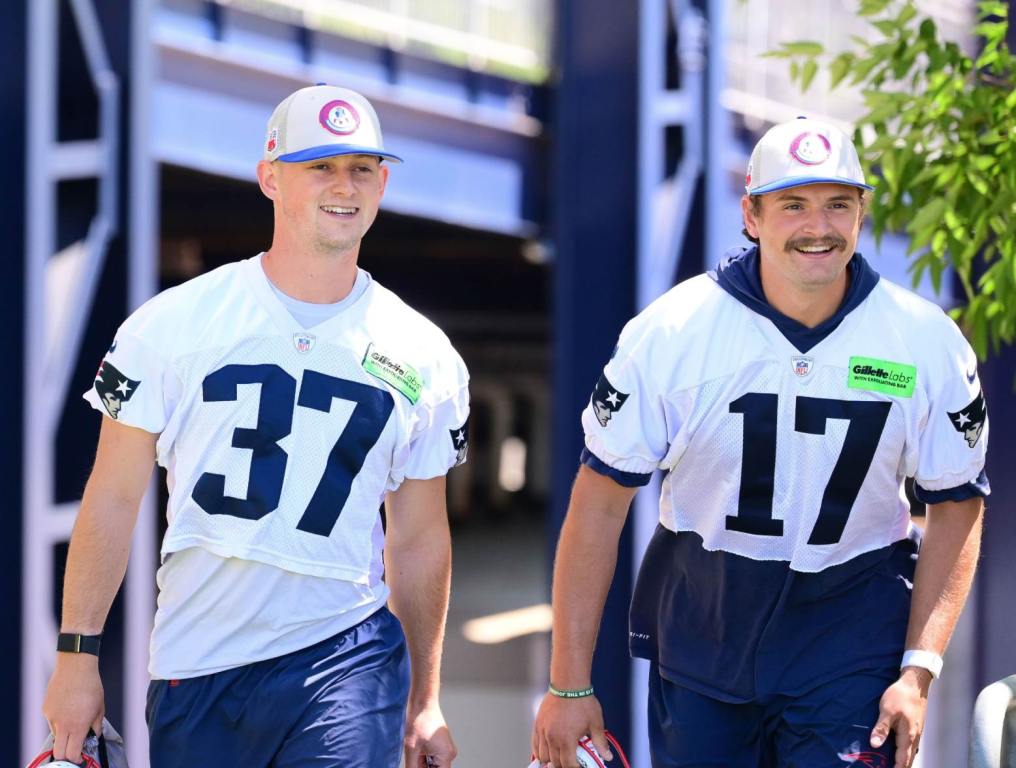 Jun 10, 2024; Foxborough, MA, USA; New England Patriots kicker Chad Ryland (37) and punter Bryce Baringer (17) walk to the practice fields for minicamp at Gillette Stadium. Credit: Eric Canha-USA TODAY Sports