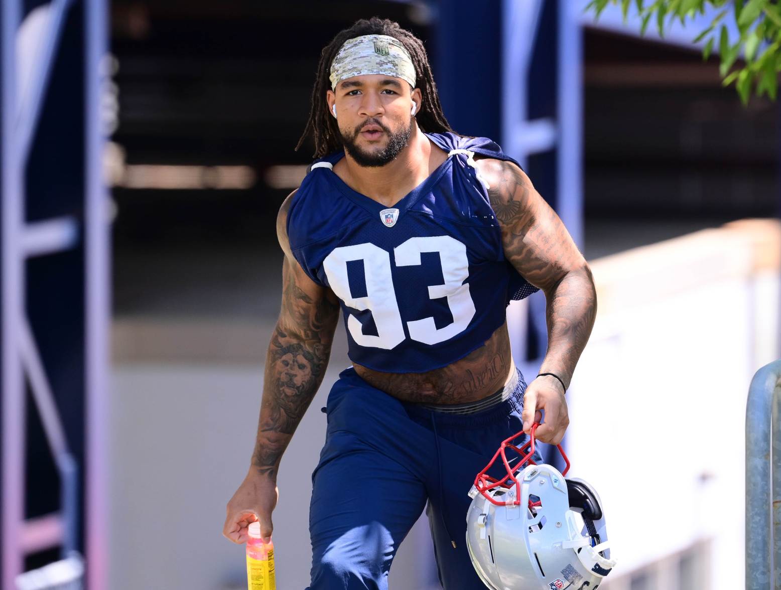 Jun 10, 2024; Foxborough, MA, USA; New England Patriots linebacker Oshane Ximines (93) walks to the practice fields for minicamp at Gillette Stadium. Credit: Eric Canha-USA TODAY Sports