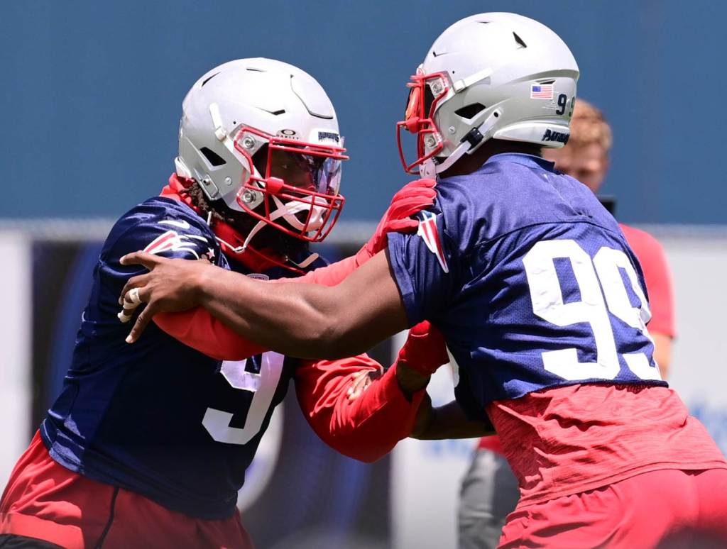 Jun 10, 2024; Foxborough, MA, USA; New England Patriots linebacker Matthew Judon (9) works with defensive end Keion White (99) at minicamp at Gillette Stadium. Credit: Eric Canha-USA TODAY Sports