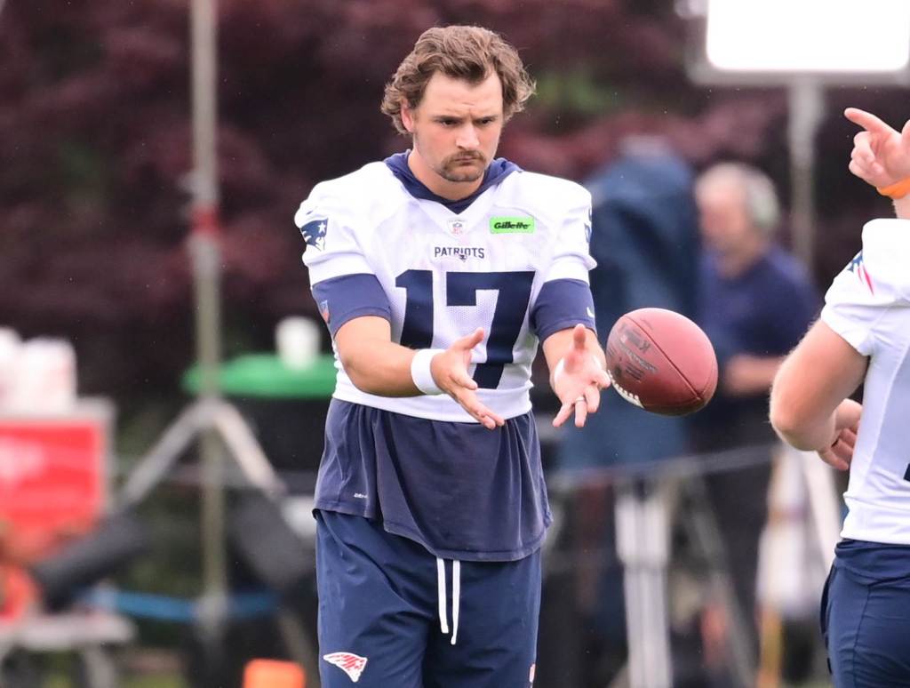 Jul 24, 2024; Foxborough, MA, USA; New England Patriots punter Bryce Baringer (17) and place kicker Joey Slye (13) toss a ball at training camp at Gillette Stadium. Credit: Eric Canha-USA TODAY Sports