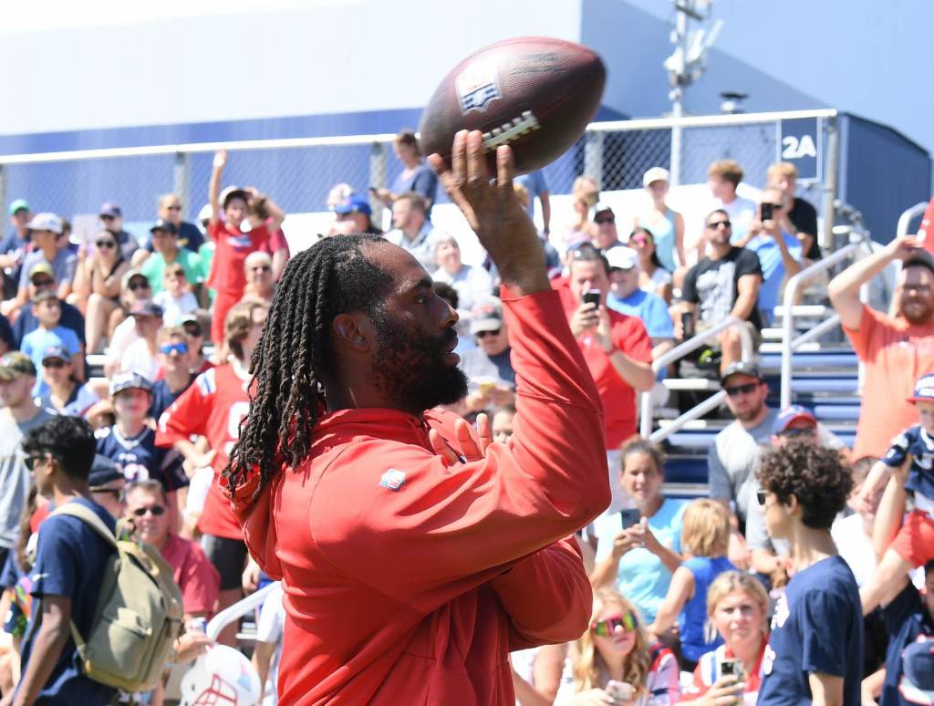 Jul 26, 2024; Foxborough, MA, USA; New England Patriots linebacker Matthew Judon (9) tosses a ball to fans during training camp at Gillette Stadium. Credit: Eric Canha-USA TODAY Sports