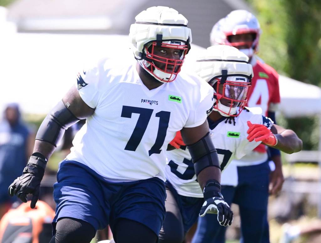 Jul 26, 2024; Foxborough, MA, USA; New England Patriots offensive tackle Mike Onwenu (71) participates in a drill during Patriots training camp at Gillette Stadium. Credit: Eric Canha-USA TODAY Sports