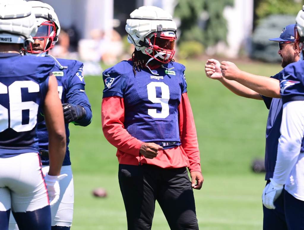 Jul 26, 2024; Foxborough, MA, USA; New England Patriots linebacker Matthew Judon (9) works with members of the coaching staff during training camp at Gillette Stadium. Credit: Eric Canha-USA TODAY Sports