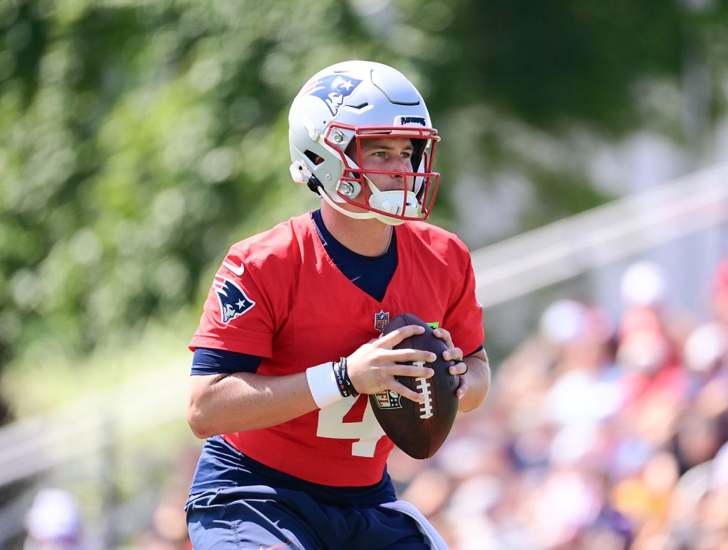 Jul 26, 2024; Foxborough, MA, USA; New England Patriots quarterback Bailey Zappe (4) throws a pass during training camp at Gillette Stadium. Mandatory Credit: Eric Canha-USA TODAY Sports