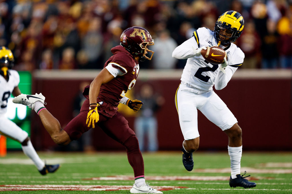 MINNEAPOLIS, MINNESOTA - OCTOBER 07: Will Johnson #2 of the Michigan Wolverines intercepts a pass intended for Daniel Jackson #9 of the Minnesota Golden Gophers in the first half at Huntington Bank Stadium on October 07, 2023 in Minneapolis, Minnesota. (Photo by David Berding/Getty Images)