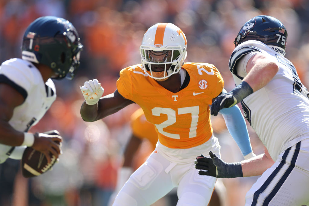 KNOXVILLE, TENNESSEE - NOVEMBER 04: James Pearce Jr. #27 of the Tennessee Volunteers defends against Devontae Houston #1 of the Connecticut Huskies and Chase Lundt #75 of the Connecticut Huskies at Neyland Stadium on November 04, 2023 in Knoxville, Tennessee. (Photo by Donald Page/Getty Images)