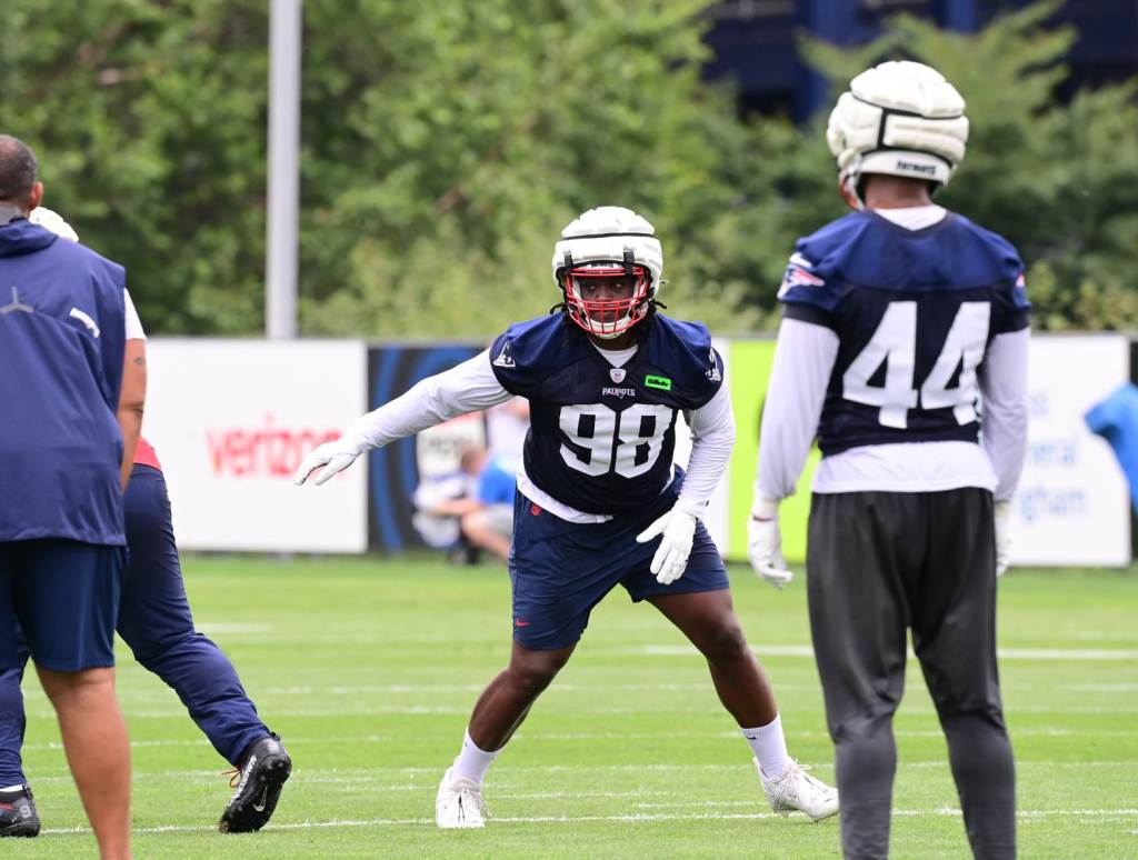 Jul 24, 2024; Foxborough, MA, USA; New England Patriots defensive tackle Jeremiah Pharms Jr. (98) works out during training camp at Gillette Stadium. Credit: Eric Canha-USA TODAY Sports