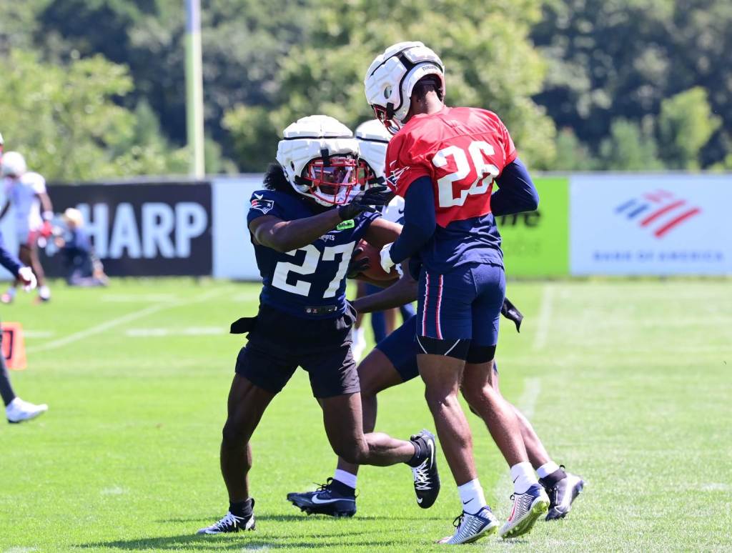 Jul 26, 2024; Foxborough, MA, USA; New England Patriots cornerback Marcellas Dial Jr (27) participates in a blocking drill with cornerback Shaun Wade (26) during training camp at Gillette Stadium. Credit: Eric Canha-USA TODAY Sports