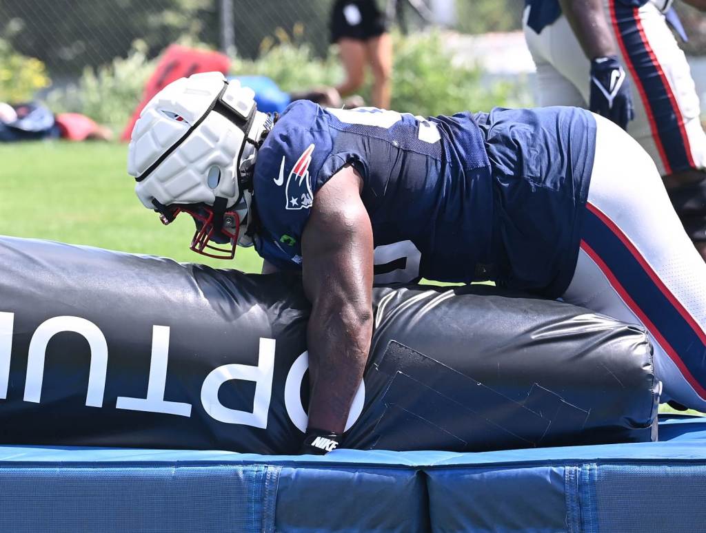 Aug 03, 2024; Foxborough, MA, USA; New England Patriots defensive tackle Jeremiah Pharms Jr. (98) works with a training aid during training camp at Gillette Stadium. Credit: Eric Canha-USA TODAY Sports