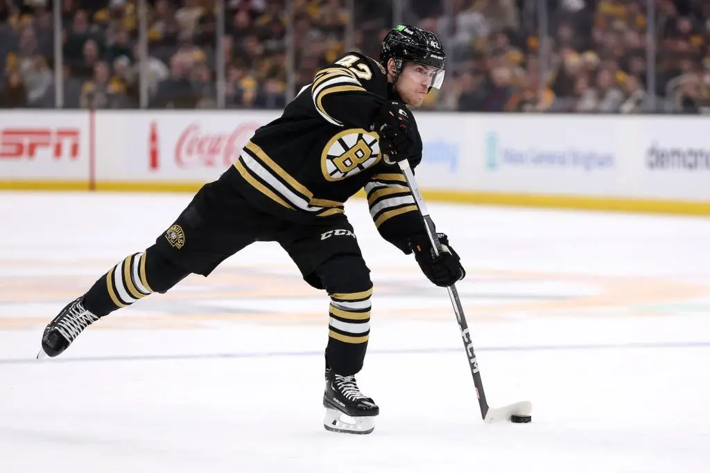 BOSTON, MASSACHUSETTS - JANUARY 04: Georgii Merkulov #42 of the Boston Bruins takes a shot against the Pittsburgh Penguins during the first period at TD Garden on January 04, 2024 in Boston, Massachusetts. (Photo by Maddie Meyer/Getty Images)