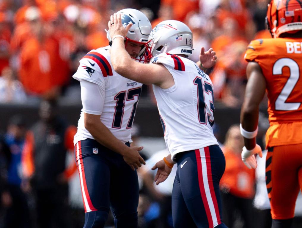 New England Patriots kicker Joey Slye (13) reacts with New England Patriots punter Bryce Baringer (17) in the third quarter of the NFL game at Paycor Stadium in Cincinnati on Sunday, Sept. 8, 2024. Photo Credit: Albert Cesare/USA TODAY Network via Imagn Images